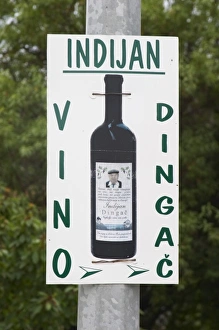 Images Dated 8th July 2006: Sign advertising Indijan Vino Dingac, the Indian Winery. Potmje village, Dingac wine region