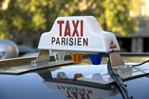 Images Dated 4th August 2007: Sign atop a taxi in Paris, France