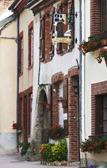 Sign that illustrates champagne and wine production, the village of Hautvillers in
