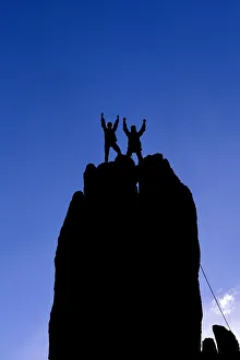 Adventure Prints: Silhouetted climbers celebrating on the summit of Eichorn Pinnacle, Yosemite National Park