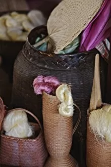Images Dated 24th February 2006: Silk thread and silk material in baskets, Chiang Mai, Thailand