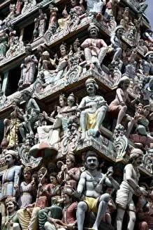 Singapore. A closed up view of Hindu Religious figures decorating the entrance of
