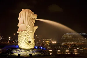Singapore Prints: Singapore. Merlion statue spewing water at night