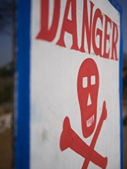 Safety Prints: Skull and crossbones danger sign, Udaipur, Rajasthan, India