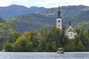 Slovenia, Bled, Lake Bled, pletna boat and Bled Island chapel