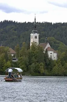 Images Dated 26th September 2004: Slovenia, Bled, Lake Bled, pletna boat and Bled Island chapel