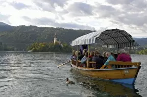 Images Dated 27th September 2004: Slovenia, Bled, Lake Bled, pletna boat and Bled Island chapel