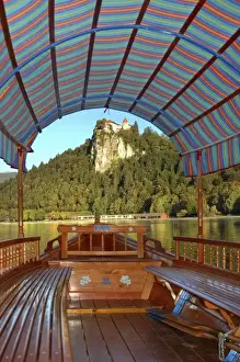 Slovenia, Bled, Lake Bled, pletna boat with view of Bled Castle