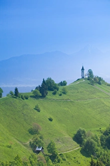 Images Dated 26th May 2004: SLOVENIA-GORENJSKA-Jamnik: Church of St. Prim & Kamnik-Savinja Alps / Morning