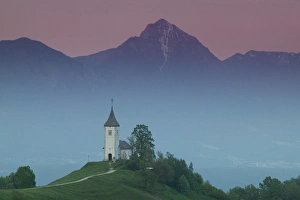 Images Dated 26th May 2004: SLOVENIA-GORENJSKA-Jamnik: Church of St. Prim & Kamnik-Savinja Alps / Evening