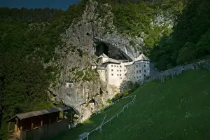 16th Century Prints: SLOVENIA-NOTRANJSKA-Predjama Castle: 16th century Predjama Castle perched atop