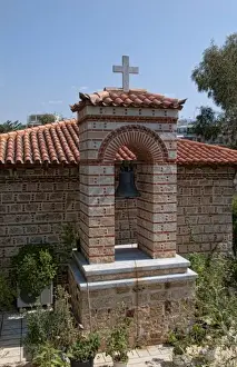 Small Greek Orthodox church right next to new Acropolis Museum in downtown Athens Greece