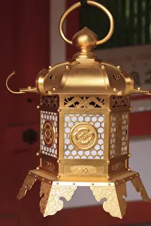 Nara Prints: Smaller metal and gold lanterns are representations of their ancient stone siblings