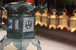 Images Dated 22nd June 2012: Smaller metal and gold lanterns are representations of their ancient stone siblings