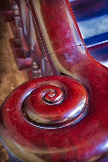 Prints of Snail shell-like curve on red wooden bannister handrail in Trinidad, Cuba Caribbean Prints: Snail shell-like curve on red wooden bannister handrail in Trinidad, Cuba