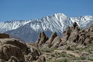 Betty Sederquist Prints: The snow-capped Sierra Nevada rise high above the granite of the Alabama Hills
