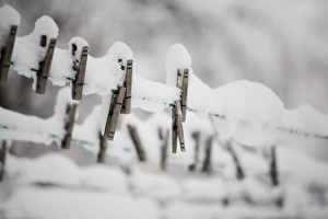 Images Dated 29th December 2006: Snow on clothes pins on a clothes line