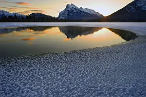 Calgary Prints: Snow crystals rim a lone break in the ice on Vermilion Lakes on a cold Banff National
