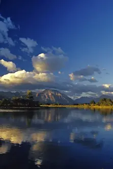 Sofa Mountain reflects into Maskinonge Lake in Waterton Lakes National Park in Alberta