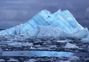 South America, Chile, San Rafael Lagoon NP. An iceberg, striated blue and white