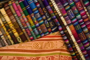 Images Dated 26th April 2007: South America, Ecuador, Otavalo, Plaza de Ponchos, tablecloths on display at the Saturday textile