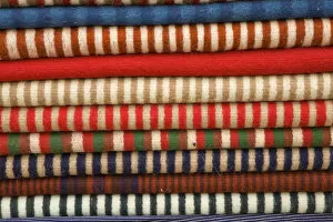 Images Dated 19th April 2007: South America, Ecuador, Saquisili, stack of ponchos at weekly food and crafts market