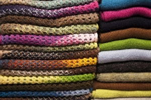 Images Dated 19th March 2009: South America, Peru, Aguas Calientes. Stack of colorful textiles made of alpaca wool