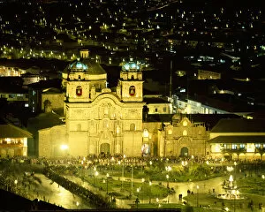 South America, Peru, Cusco. Nighttime aerial view of the main square featuring the