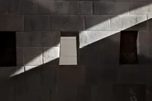 Inca Prints: South America, Peru, Cuzco. A beam of sunlight slices through the Inca Temple of the Sun