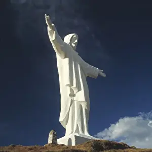 Cusco Prints: South America, Peru, Cuzco. A dramatic view of the statue of Christ that stands above Cuzco