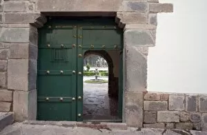 South America - Peru. Looking into courtyard through door with Inca wall foundation