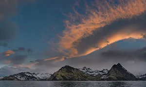 Images Dated 23rd January 2024: South Georgia Island. Landscape of snow-covered mountain with dramatic cloud
