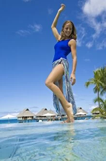 South Pacific, Bora Bora, Female tourist poolside. (PR / MR)