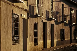 Spain, Almagro, Castile-La Mancha Cobblestone street with traditional houses