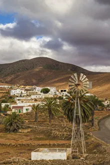 Prints of Spain, Canary Islands, Fuerteventura Island, Toto, desert village view with windmill Images Dated 2019 November: Spain, Canary Islands, Fuerteventura Island, Toto, desert village view with windmill