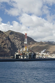 Spain, Canary Islands, Tenerife. Muelle Sur port area. Oil rig