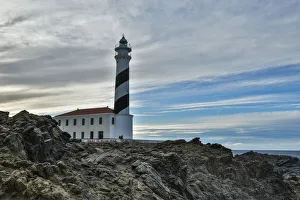 Architecture Collection: Spain, Menorca. Lighthouse at Cavalleria at sunrise