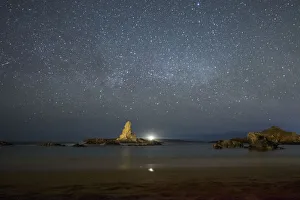 Place Prints: Spain, Menorca, Pregonda. Night sky at the beach