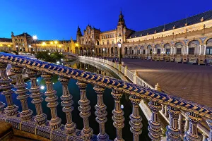 Lighting Prints: Spain, Seville. Plaza de Espana lit at sunset