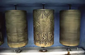 Tibetan Prints: Spinning prayers wheels is said to send your prayers to heaven for Tibetan Buddhists