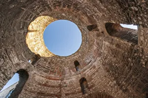 Dalmatia Prints: Split, Croatia. Looking upward inside Diocletians Palaces peristyle