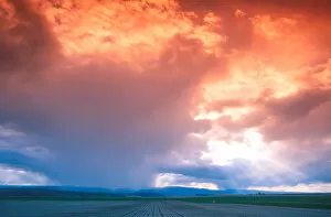 Spring rain clouds at sunset over eastern Oregon farm land. weather, clouds