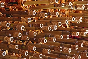 Handle Prints: Stack of umbrella handles awaiting final assembly, Bosang, Chiang Mai, Thailand