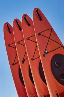 Kayak Prints: Stacked red kayaks on a beach, Florida, USA