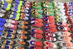 stacks of athletic shoes, shops around Nine Pedestrian Street, Guangzhou, China