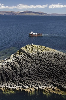 Images Dated 9th May 2010: Staffa tour boat and polygonal basalt