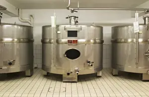 Holding Prints: Stainless steel fermentation tanks of an unusual shape wider than they are high