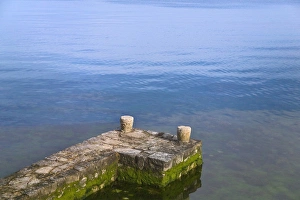 Istria Prints: Stakes to tie boat on dock by Adriatic Sea, Porec, Istria, Croatia