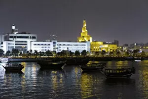 State of Qatar, Doha. Dhow harbor at night. Left: Ministry of Finance
