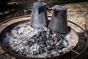 Coffee Prints: Still-life of two coffee pots keeping warm in the ashes of a fire
